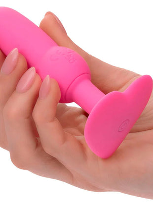 Ein lebhaftes rosa silikon-analkugel mit glatter textur und abgerundetem kopf von calexotics