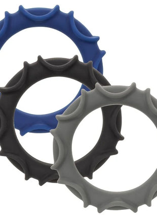 Set aus drei silikonringen in blau schwarz und grau mit zahnradähnlicher struktur calexotics pro stroker optimale power
