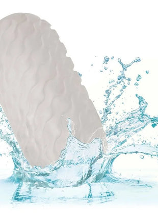 A sleek off-white silicone reversible nubby stroker with a textured wavy surface by CalExotics