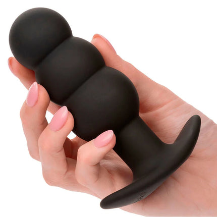 Schwarzer Silikon-analplug von CalExotics mit gerundetem, segmentiertem Körper und abgeflachtem Sockel für 10 Vibrationsmodi