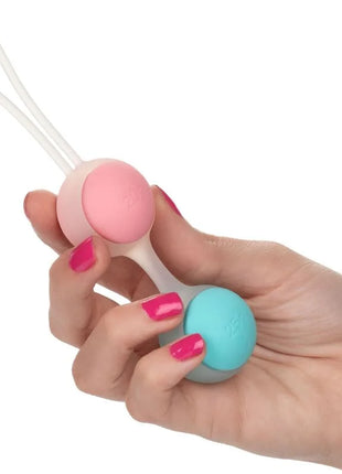 Pink und türkise silikon eierperlen mit weißem griff vom calexotics she-ology set bolas kegels austauschbar