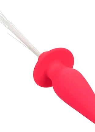 Roter silikon analplug mit weißer borstenbürste oben calexotics southern lights leuchtender analstecker rosa