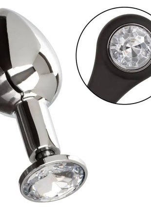 Shiny chrome-plated anal plug mit schwarzer Silikonbasis und zwei klaren facettierten Kristallen von CalExotics