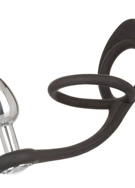Schwarzer silikonring mit silbernem metallstecker und flexiblem stiel calexotics star fucker mini plug