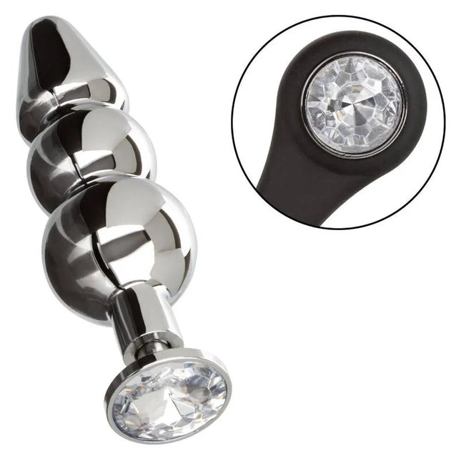 Shiny chrome-plated anal plug with three spherical beads and black silicone base featuring a clear crystal by CalExotics
