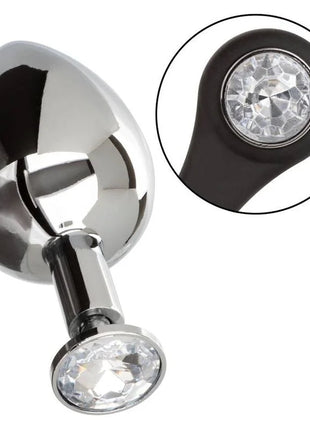 Shiny chrome-plated anal plug with two clear faceted crystal stones set in black rubberized bases by calexotics