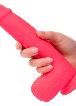 Ein lebhafter rosa strukturierter silikonvibrator mit konischem kopf und zwei abgerundeten basen von calexotics