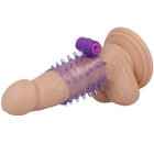Ein lilafarbener und hautfarbener silikonvibrator mit strukturierter, stacheliger oberfläche und steuerungstaste