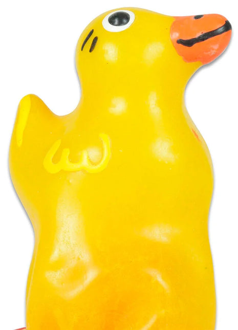 Ein leuchtend gelber gummienten kondom mit orangefarbenem schnabel und schwarz dargestellten augen von condomerie