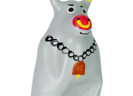 Graue glasfigur eines stiers mit gelben hörnern roter und gelber nase schwarzen augendetails und schwarzer kette mit orangefarbenem glöckchen aus der condomerie handbemalte neuheitskondome modell xl