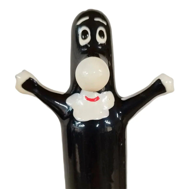 Schwarze glossy figur aus kunststoff mit weißen augen und rundem bauchknopf bei condomerie handbemalte novelty kondome happy puppet xl