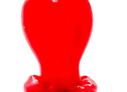 Ein glänzendes, rotes herzförmiges kerzenmodell mit leicht geschmolzenem boden von condomerie handbemalt