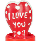 Rote herzförmige kerze mit weißen punkten und i love you in weißer glasur von condomerie handbemalt