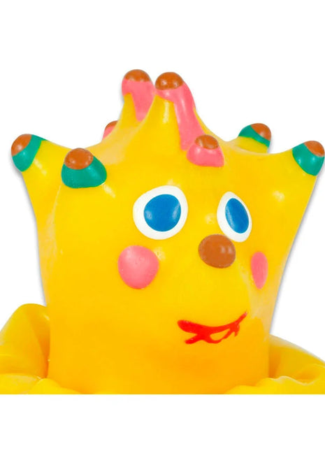 Ein fröhliches gelbes gummi-badspielzeug in kronenform mit bunten stacheln für condomerie handbemalte neuheitskondome igel