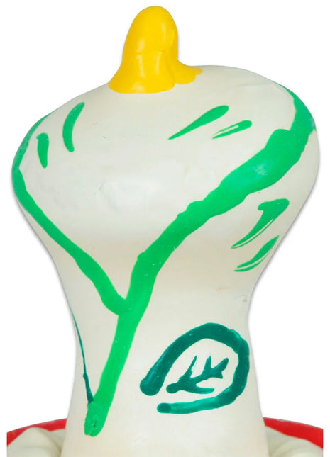 Weiße glänzende plastikfigur in zwiebelform mit grünen markierungen und gelbem oberteil von condomerie handbemalte kondome kala