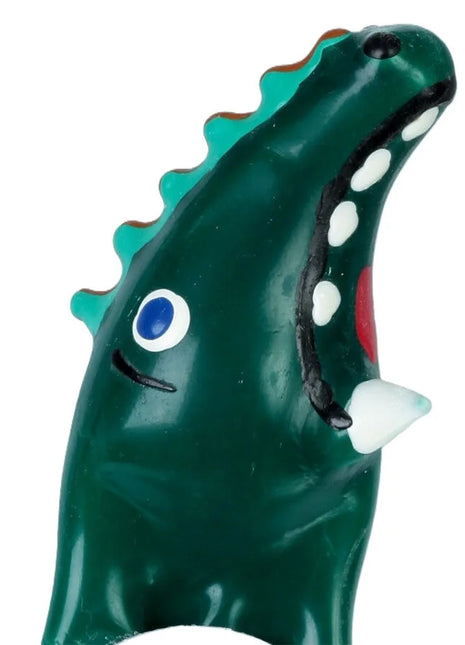 Ein glänzendes dunkelgrünes dinosaurier-krokodil modell xl aus plastik mit teal farbenen stacheln für kondome