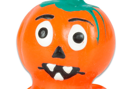 Orange plastik halloween kürbisfigur mit grünem stiel und schwarz-weißen handbemalten gesichtszügen, condomerie novelty kondome
