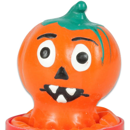 Orange plastik halloween kürbisfigur mit grünem stiel und schwarz-weißen handbemalten gesichtszügen, condomerie novelty kondome
