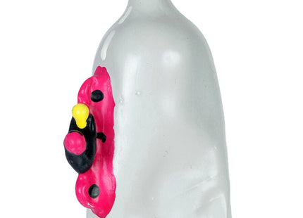 Translucente weiße kerze in kondomform mit handbemaltem pink-schwarz-gelbem cartoonmotiv bei condomerie motorrad xl