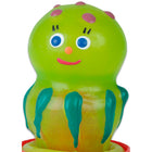 Eine fröhliche limettengrüne kunststoffspielzeug-octopus mit lila punkten blauäugig orangener nase und teal-fühlern aus der condomerie handbemalte neuheitskondome quallen serie