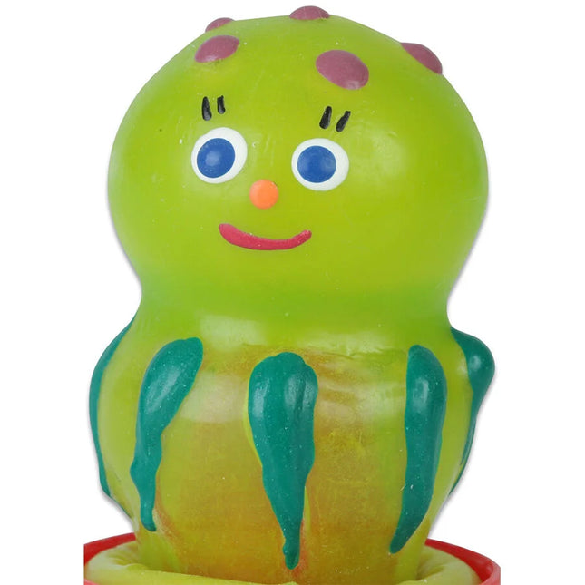 Eine fröhliche limettengrüne kunststoffspielzeug-octopus mit lila punkten blauäugig orangener nase und teal-fühlern aus der condomerie handbemalte neuheitskondome quallen serie