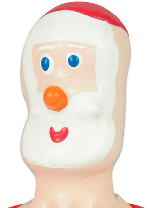 Ein fröhliches santa claus gesicht aus geformtem kunststoff mit weißem bart rotem hutbesatz blauen augen oranger nase und roten lippen für condomerie handbemalte neuheitskondome santa