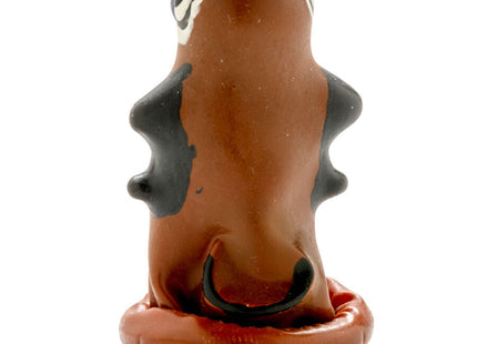 Braune keramikfigur mit schwarz wei bemalten augen spitzen schulterähnlichen hervorhebungen und gebogenem mund aus condomerie handbemalte neuheitskondome schnellkönig