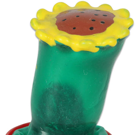 Transparenter grüner kunststoffspielzeug sonnenblume mit gelbem blütenblatt und rotem schwarzem kern von condomerie
