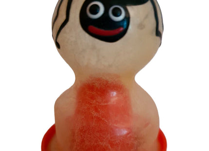 Transluzente gelartige spinnfiguren-kondome mit schwarzem gesicht, großen weißen augen und rotem lächeln von condomerie