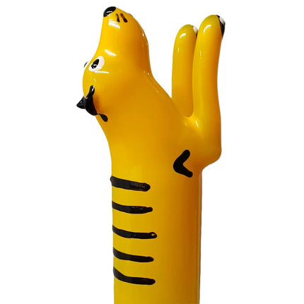 Bright yellow tiger-shaped handbemalte novelty condom with black stripes from condomerie tiger xl series