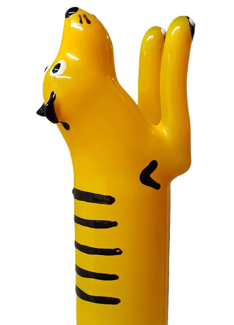 Bright yellow tiger-shaped handbemalte novelty condom with black stripes from condomerie tiger xl series