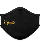 Schwarze wiederverwendbare stoffmaske mit gold stickerei coquette chic desire text