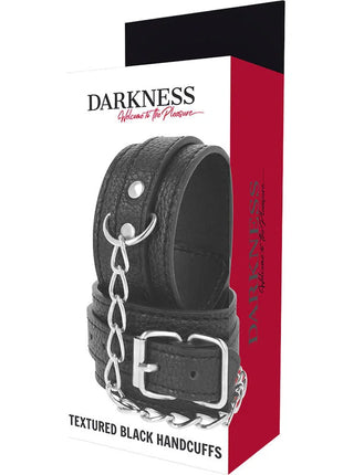 Schwarze handschellen aus strukturiertem leder mit silberner metallkette und schnalle im modell darkness