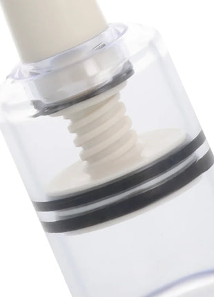 Transparenter nipplensauger darkness aus klarem kunststoff mit weißem screw-top und zwei schwarzen horizontalbändern