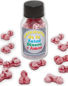 Eine klare glasflasche mit schwarzem deckel enthält rote knochenförmige karamellbonbons zuckerpudrig diablo picante bonbons
