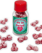 Eine klare glasflasche mit rotem deckel und grünem etikett enthält rosa, knochenförmige gesundheitsbonbons diablo picante eisbeere/kirsche