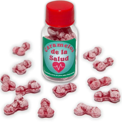 Eine klare glasflasche mit rotem deckel und grünem etikett enthält rosa, knochenförmige gesundheitsbonbons diablo picante eisbeere/kirsche