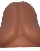 Brauner silikon anti-stressball in form eines gesäßes als diablo picante produkt für stressabbau