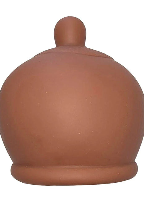 Braunes brustförmiges stressspielzeug terrakottafarbener keramiktopf mit rundem körper und kleinem gewölbtem deckel