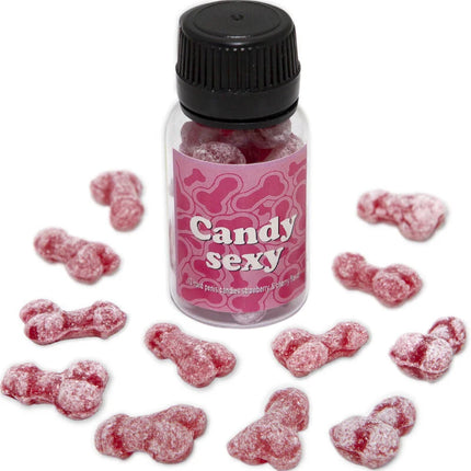 Eine klare plastflasche mit schwarzem deckel und pinkem etikett mit knochenmustern gefüllt mit roten zuckerbedeckten gummibärchen in form von penis mit erdbeer-kirsch-geschmack diablo picante candy sexy glas