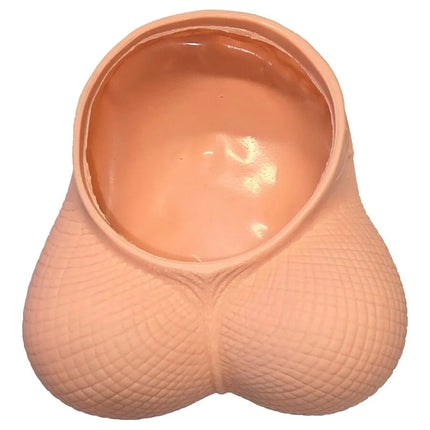 Peachfarbener silikon novelty planter in form eines pausbäckigen eierleerbeutels mit strukturierter oberfläche