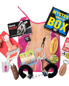 Pink apron mit anatomischer abbildung und erotischen accessoire wie handschellen im diablo picante geheimnisbox für ihn