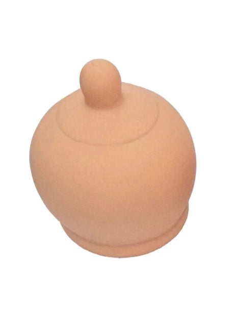 Beige silikon-nippelschild diablo picante mit abgerundeter kuppelform und kleinem knopf oben in brustform