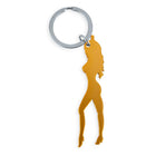 Goldfarbener metall schlüsselanhänger mit weiblicher silhouette mit langen haaren und high heels inklusive bieröffner