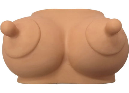 Beiges silikon brustförmiges sparschwein namens diablo picante hellton für massagezwecke