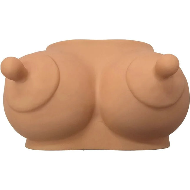 Beiges silikon brustförmiges sparschwein namens diablo picante hellton für massagezwecke