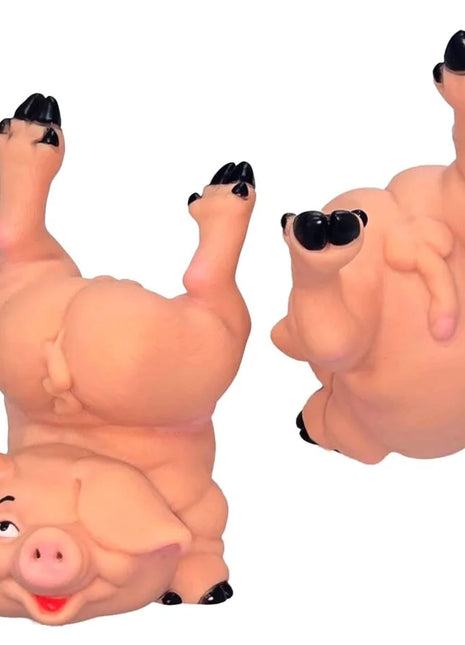 Pinkes gummispardose sparschwein diablo picante in spielerischer kopfstand pose mit schwarzen hufen und augen