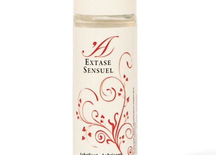 Eine klare glasflasche mit weißem deckel und rotem blumendesign, extase sensuel erdbeer geschmacktes gleitmittel 100 ml