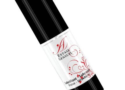 Schwarze und weiße zylindrische flasche mit rotem blumendesign labeled extase sensuel erdbeer duftendes gleitmittel 100 ml
