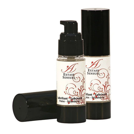 Schwarze pumpflasche extase sensuel erdbeer schmiermittel 30 ml mit weißem etikett und roten floralen mustern